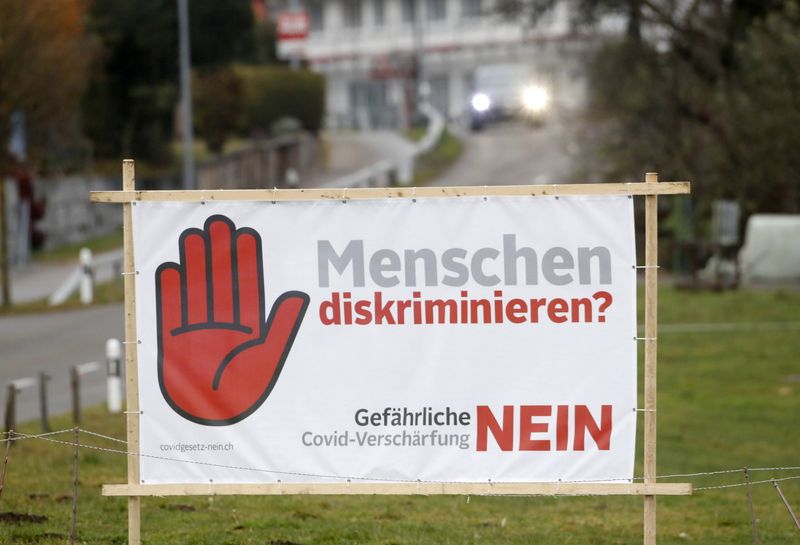 Poster is seen before Swiss voters decide about the federal