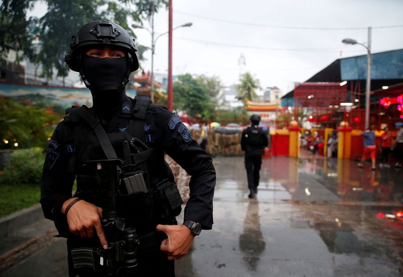 FILE PHOTO: An anti terror policeman stands guard as a