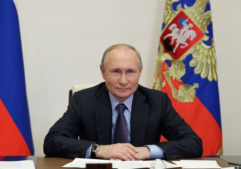 FILE PHOTO: Russian President Putin takes part in a ceremony