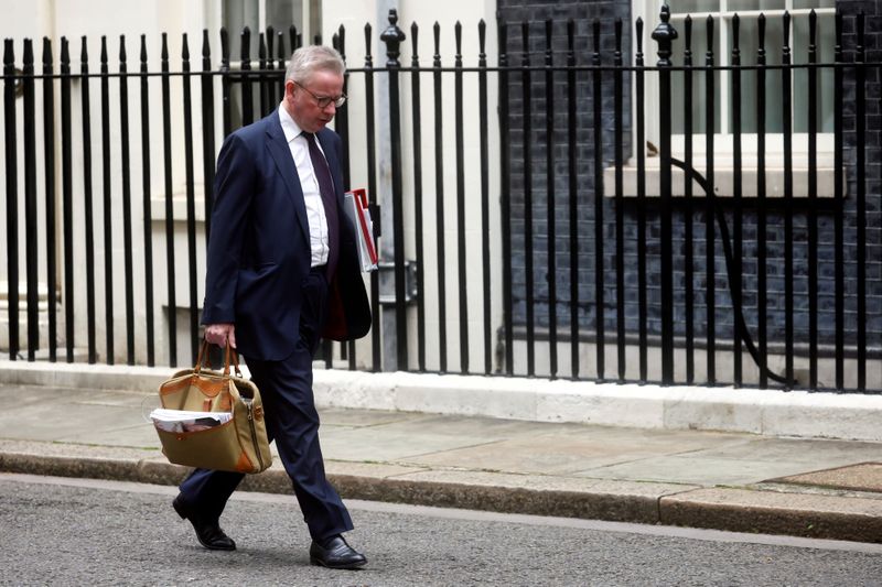 FILE PHOTO: Britain’s Housing Secretary Michael Gove walks in Downing