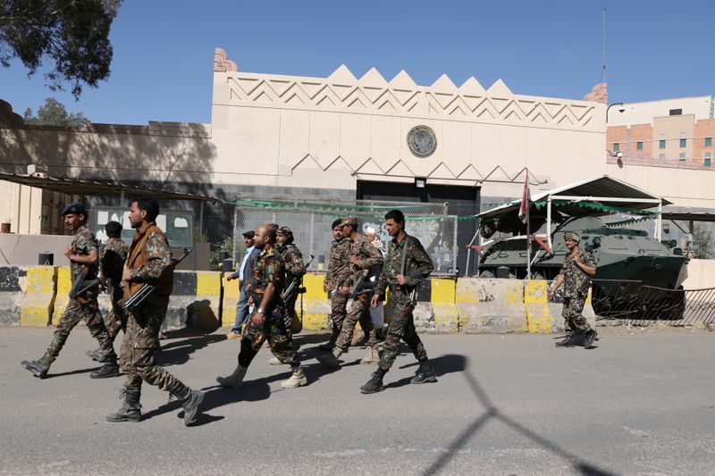 FILE PHOTO: Houthi soldiers walk past the the U.S. embassy’s