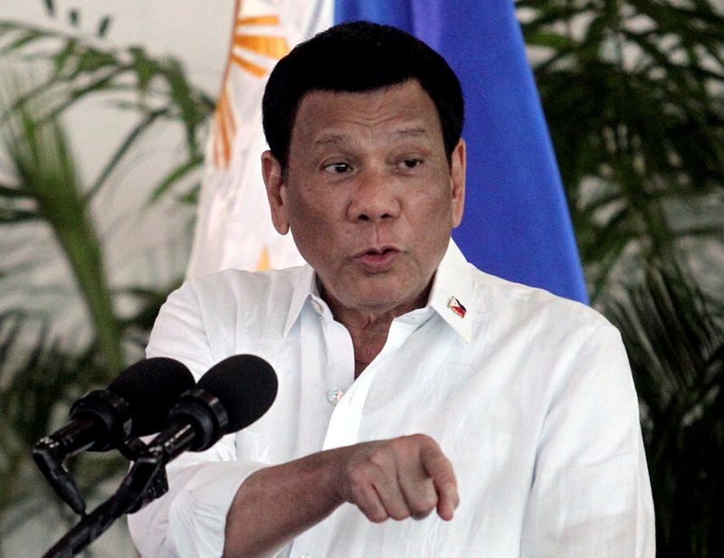 FILE PHOTO: President Rodrigo Duterte speaks after his arrival in