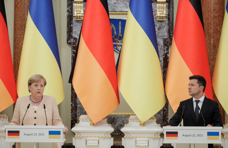 FILE PHOTO: Ukrainian President Volodymyr Zelenskiy and German Chancellor Angela