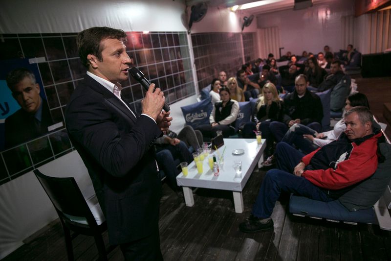 FILE PHOTO: Lawmaker Razvozov addresses Russian-speaking Israelis as he campaigns