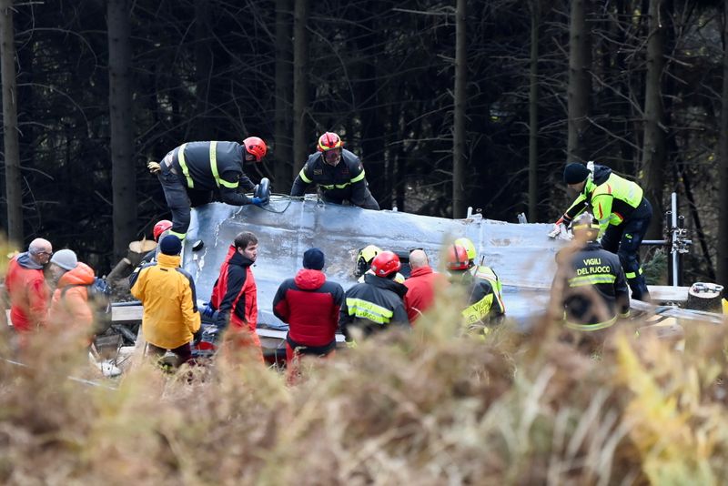 FILE PHOTO: Italian fire brigade works to remove crashed cable