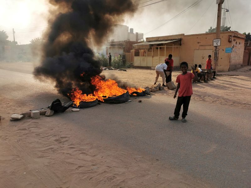 FILE PHOTO: A road barricade is set on fire during
