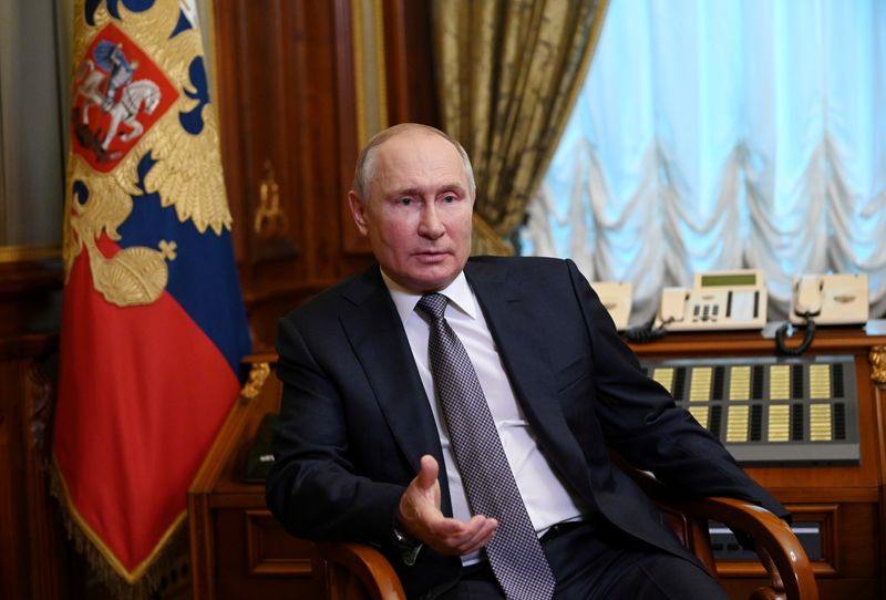 FILE PHOTO: Russian President Putin answers questions about his article