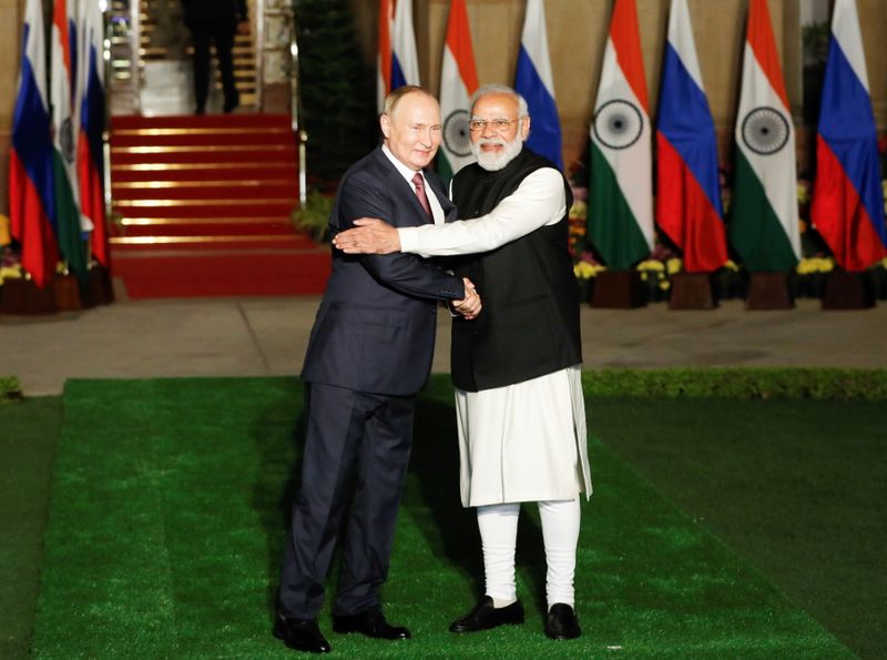 Russia’s President Putin meets with India’s PM Modi, in New