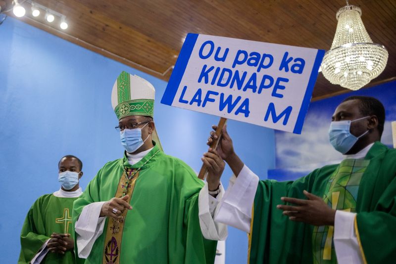 FILE PHOTO: Catholics attend Sunday Mass in Port-au-Prince