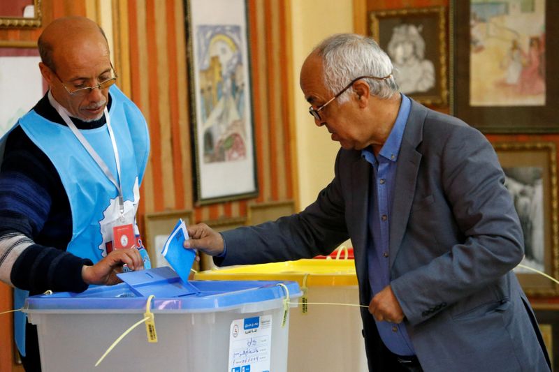 FILE PHOTO: A man casts his vote at a polling