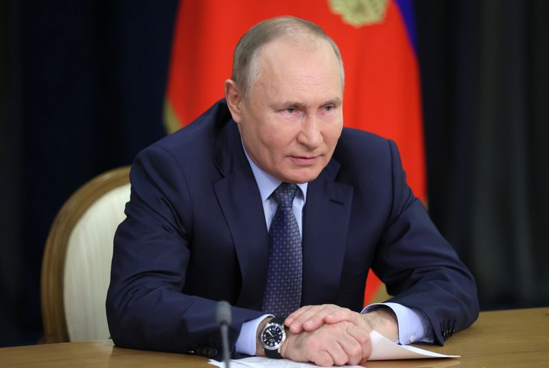 Russian President Vladimir Putin takes part in a ceremony via