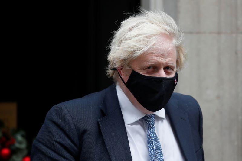 FILE PHOTO: Britain’s PM Johnson walks outside Downing Street in