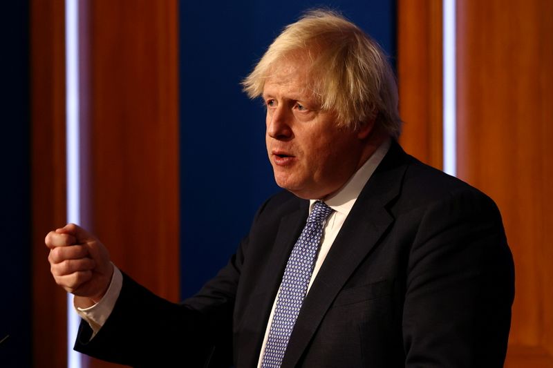 FILE PHOTO: British Prime Minister Boris Johnson holds a news