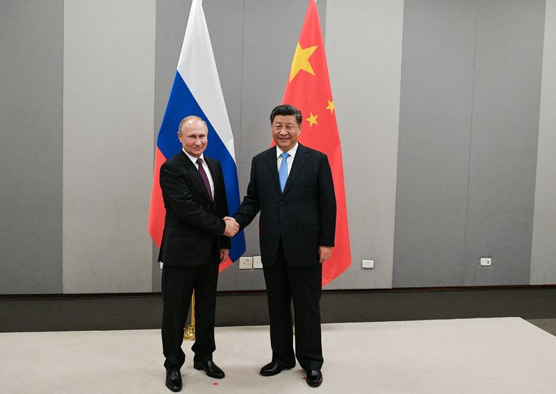 FILE PHOTO: Russian President Putin meets with Chinese President Xi