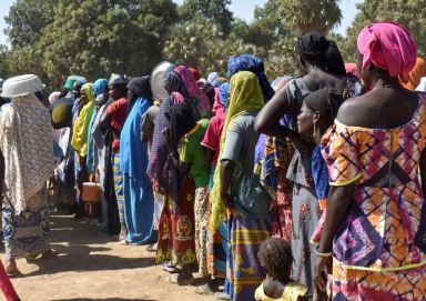 FILE PHOTO: Cameroonians who fled intercommunal violence queue at temporarily