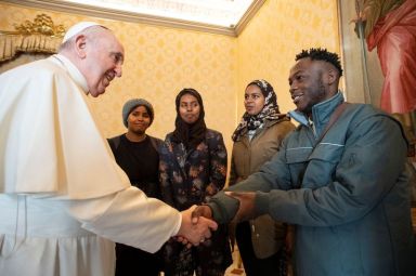 Pope Francis greets migrants from refugee camps in Cyprus, as