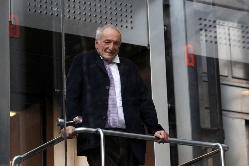 FILE PHOTO: Architect Richard Rogers poses inside an elevator in