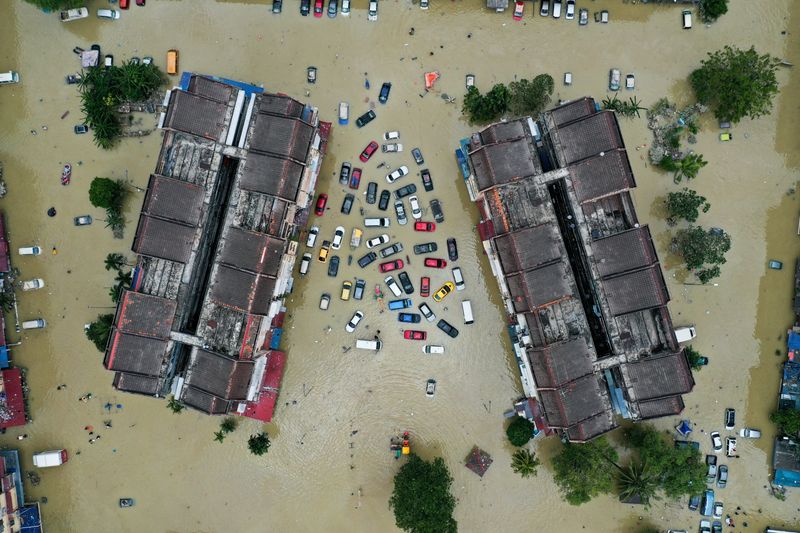 Aerial view shows vehicles submerged in flood waters in Shah