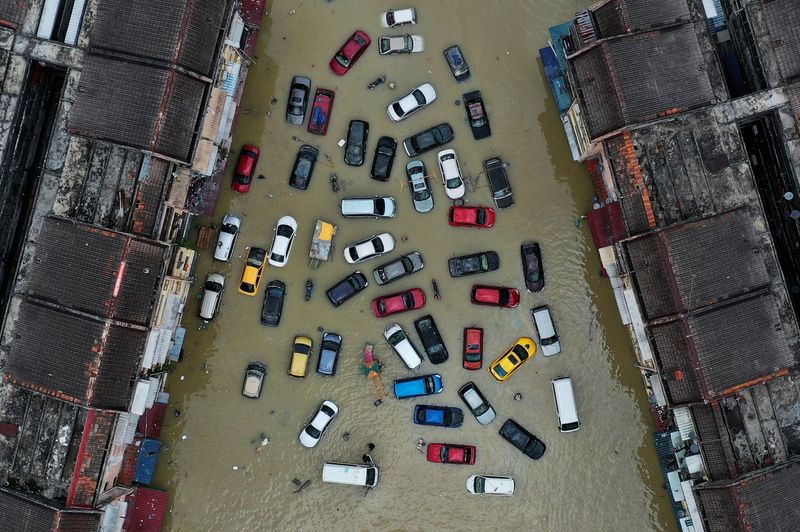 FILE PHOTO: Aerial view shows vehicles submerged in flood waters