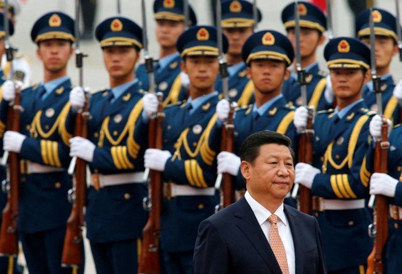 FILE PHOTO: Chinese President Xi Jinping inspects an honour guard