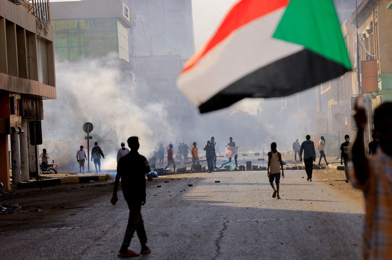 FILE PHOTO: Protesters march to the presidential palace in Khartoum
