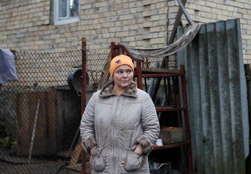 Local resident Serheyeva is seen near her house near the