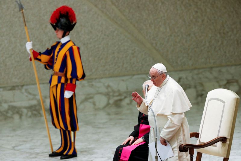 FILE PHOTO: Pope Francis delivers Christmas messages to workers at