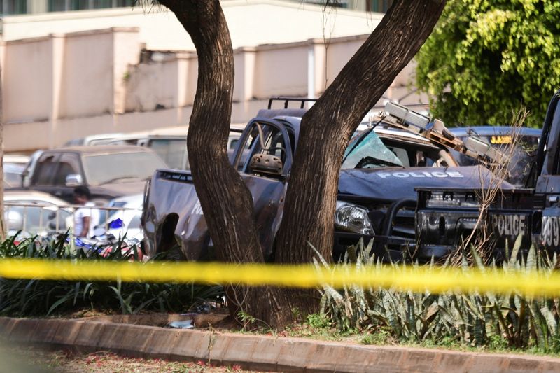 A general view shows wreckages of police vehicles at the