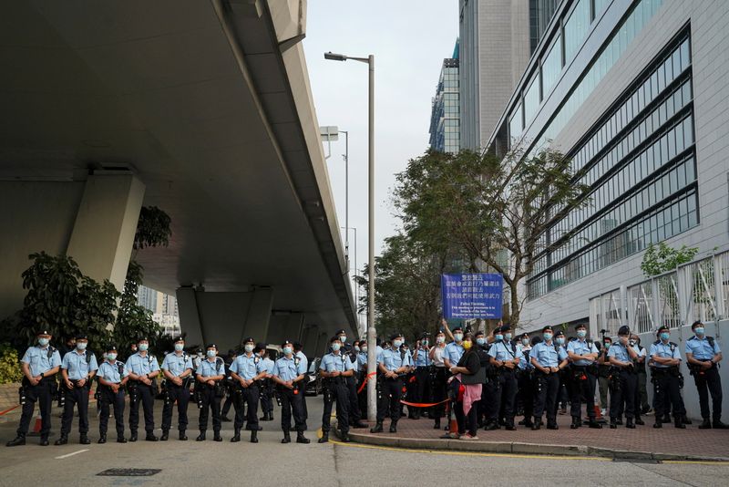 Police officers outside West Kowloon Magistrates’ Courts in Hong Kong