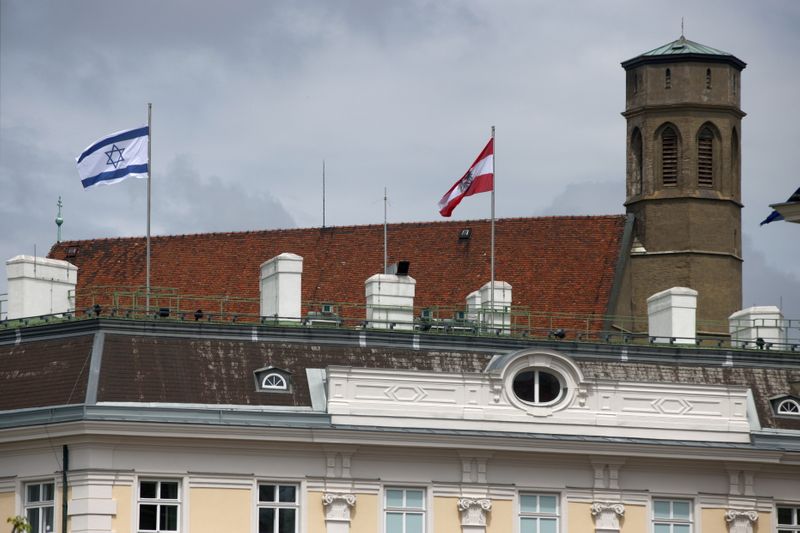 The national flag of Israel is seen atop the federal