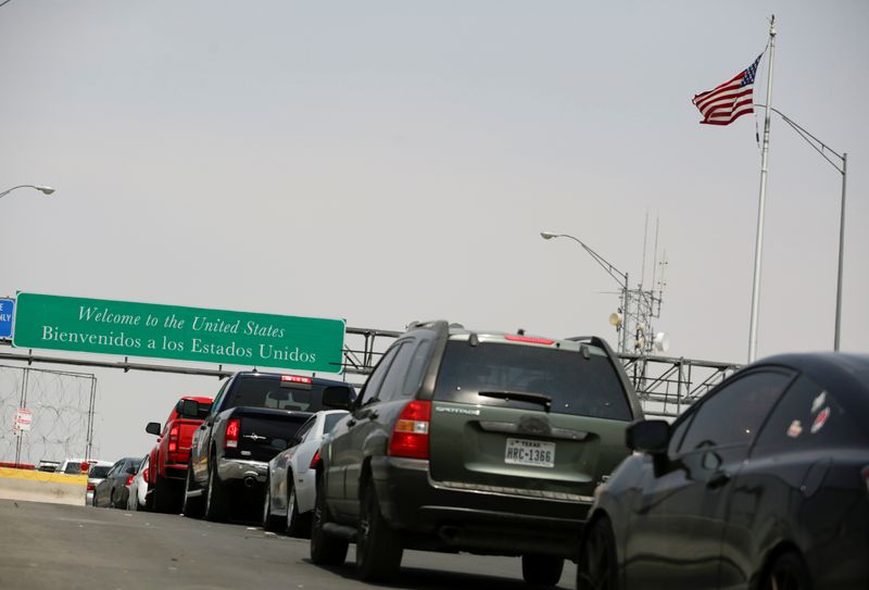 Cars stand in line at the Cordova International Bridge at