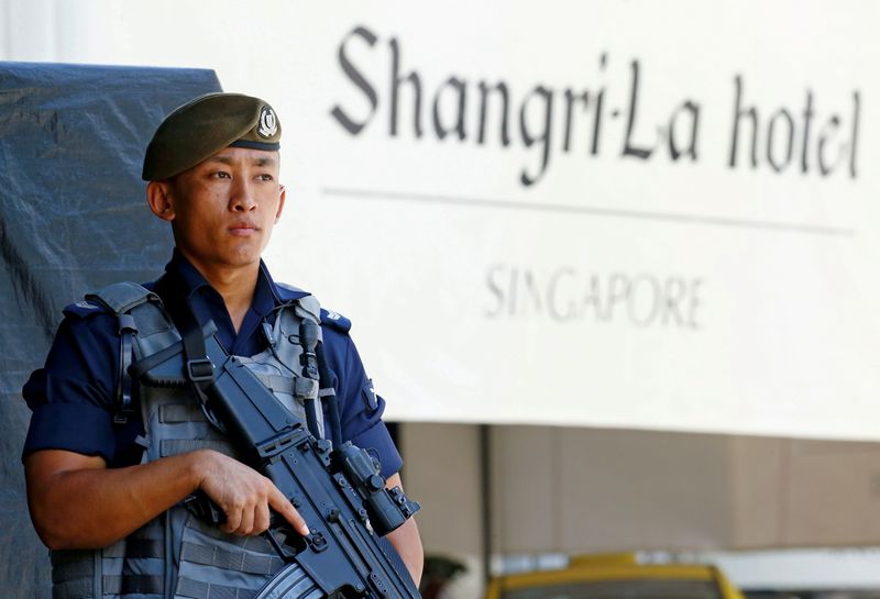 FILE PHOTO: A Gurkha police officer stands guard outside the