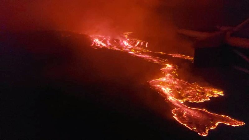 An aerial view shows lava flowing from the volcanic eruption