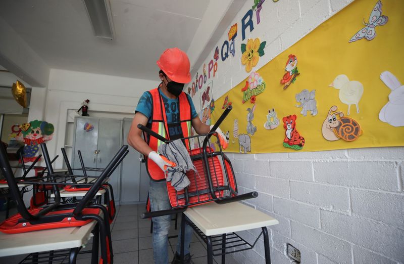 Workers prepare a school ahead of reopening in Mexico City