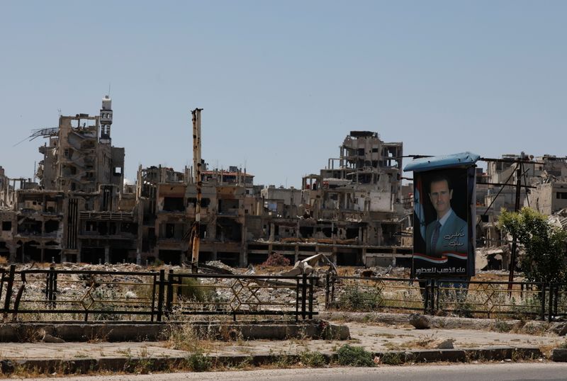 A poster depciting Syria’s President Bashar al-Assad is pictured near