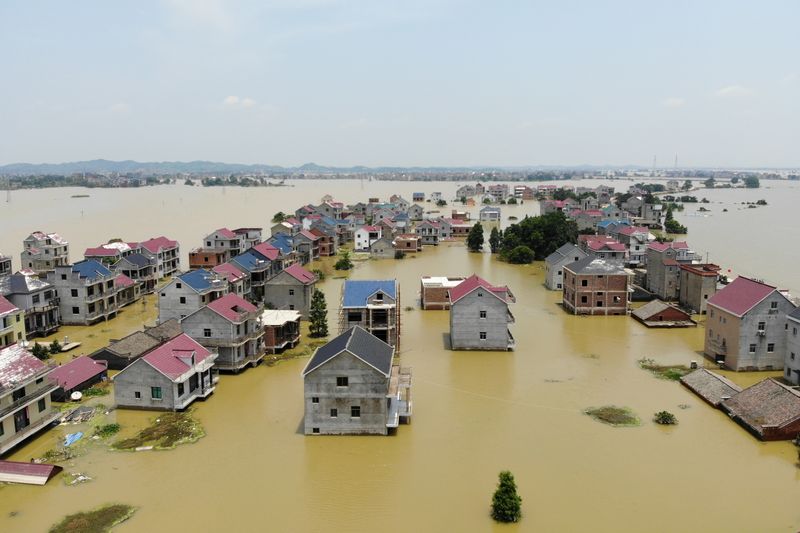 FILE PHOTO: Buildings and farmlands are seen partially submerged in