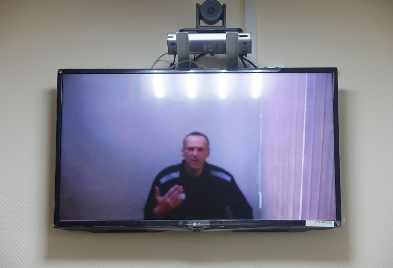Russian opposition leader Alexei Navalny is seen on a screen