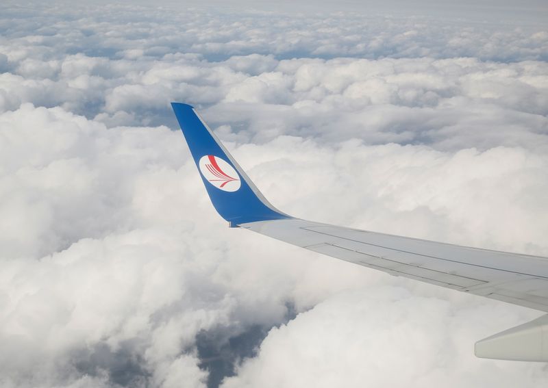 FILE PHOTO: A wing of a plane of Belavia company