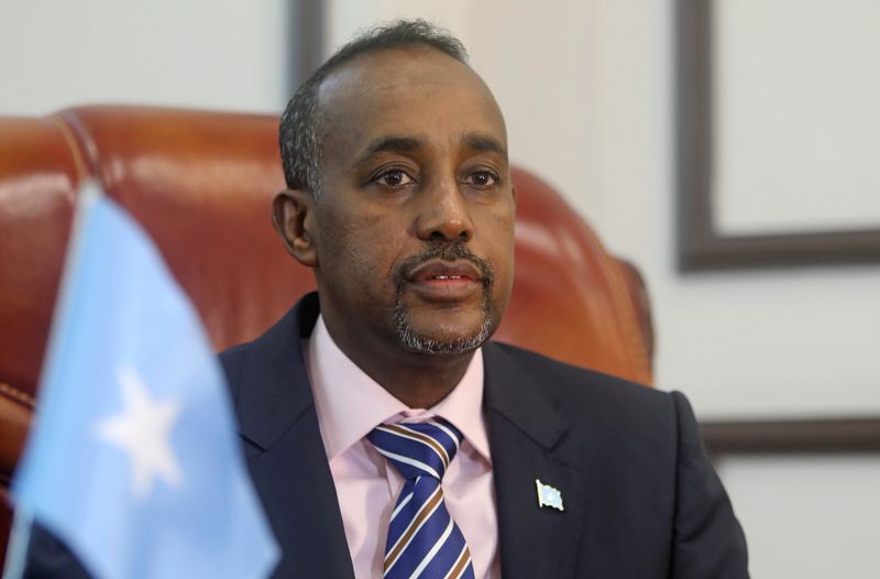 Somalia’s PM Mohamed Hussein Roble looks on before addressing members