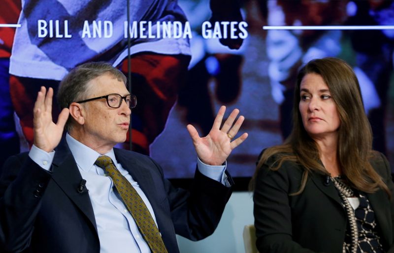 FILE PHOTO: Bill and Melinda Gates attend a debate on