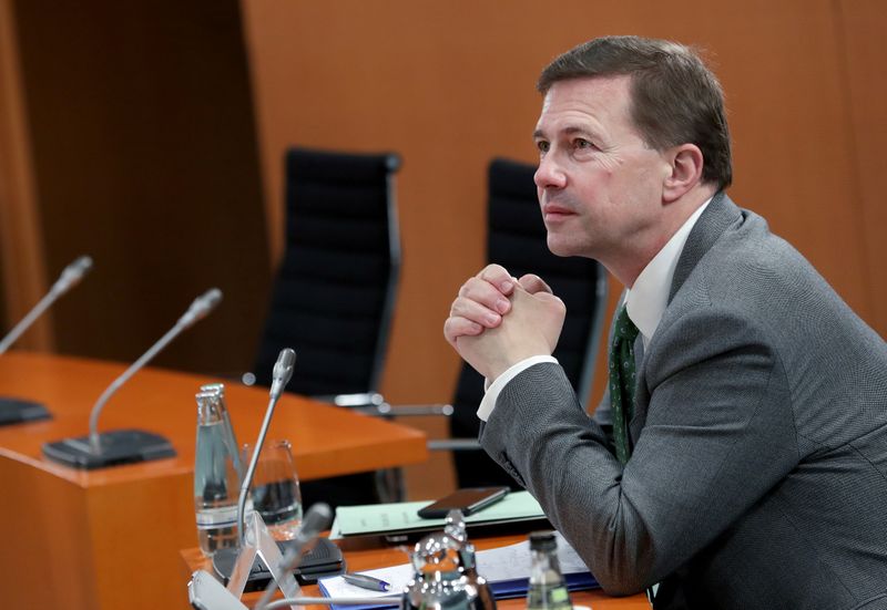 Germany’s Government Spokesperson Steffen Seibert folds his hands prior to