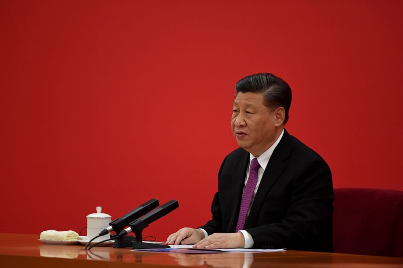 China’s President Xi Jinping speaks with Russian President Vladimir Putin