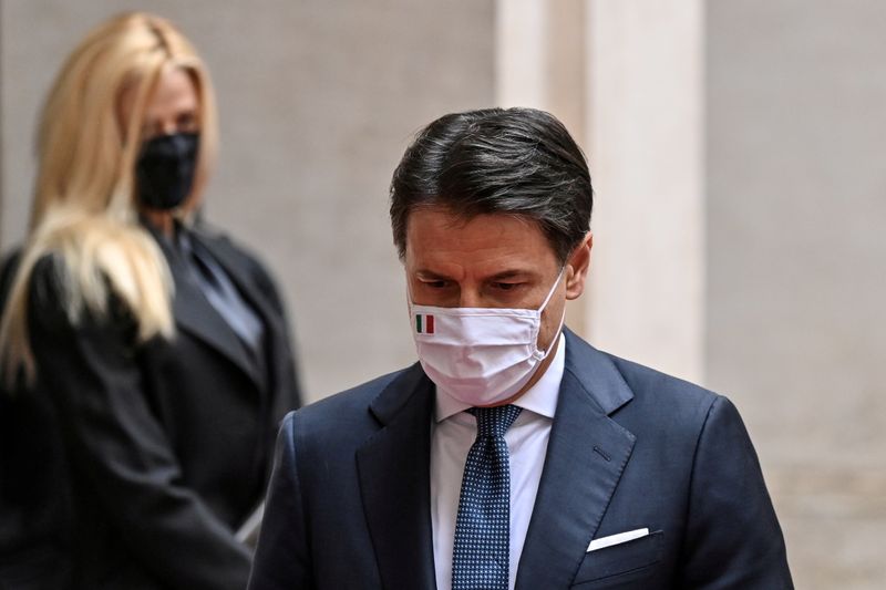 FILE PHOTO: Italy’s outgoing Prime Minister, Giuseppe Conte walks past