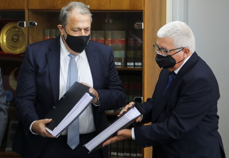 Myron Nicolatos, former Cyprus Chief Justice, hands over findings to