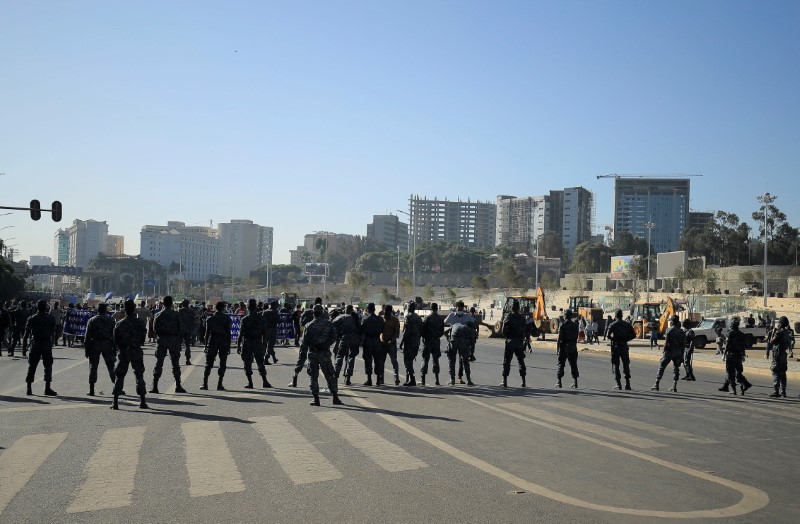 FILE PHOTO: Ethiopian Federal Police officers stand guard as pro-government