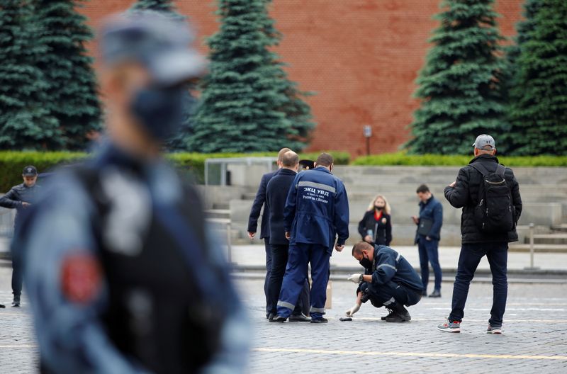 FILE PHOTO: Investigators work in Red Square after an opposition