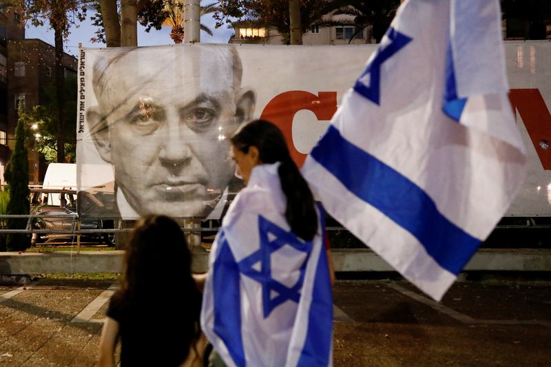 Supporters of the new Israeli government celebrate in Tel Aviv