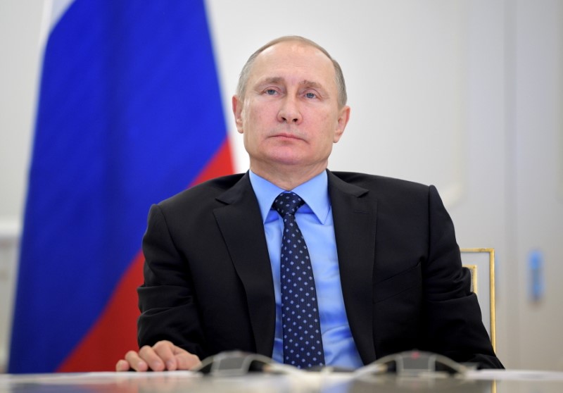FILE PHOTO: Russian President Putin takes part in a video
