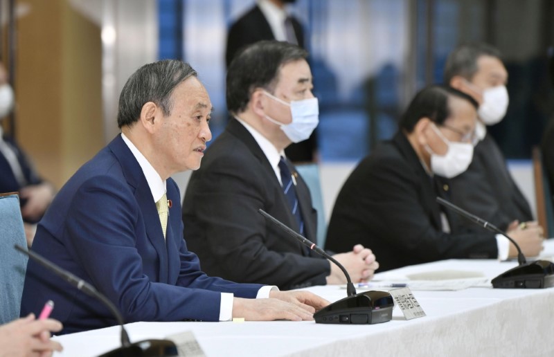 Japan’s Prime Minister Yoshihide Suga attends a cabinet meeting at