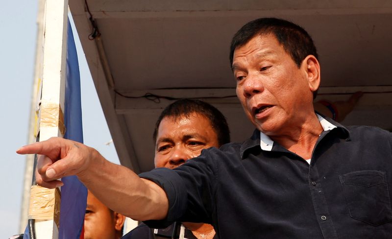 FILE PHOTO: Presidential candidate Rodrigo “Digong” Duterte greets supporters during